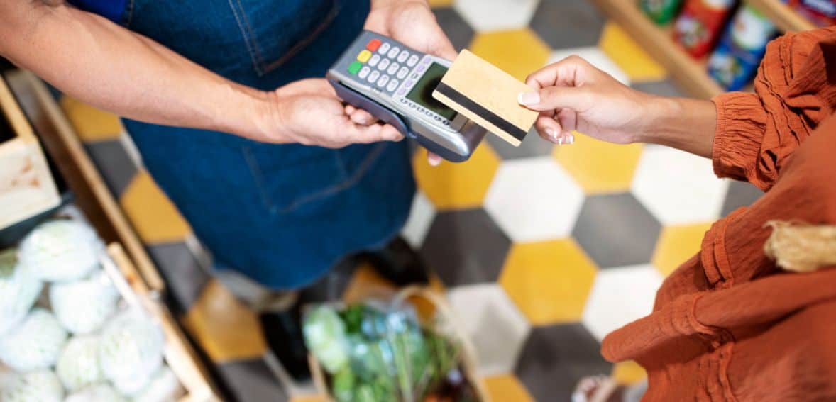 Customer paying with card at store