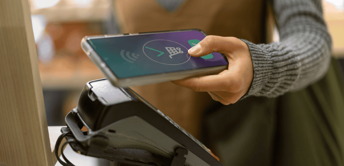 Person using EBT card payment terminal for food assistance transactions.